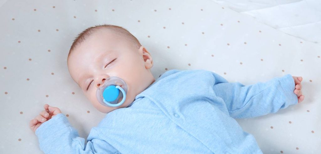 sleeping baby with dummy