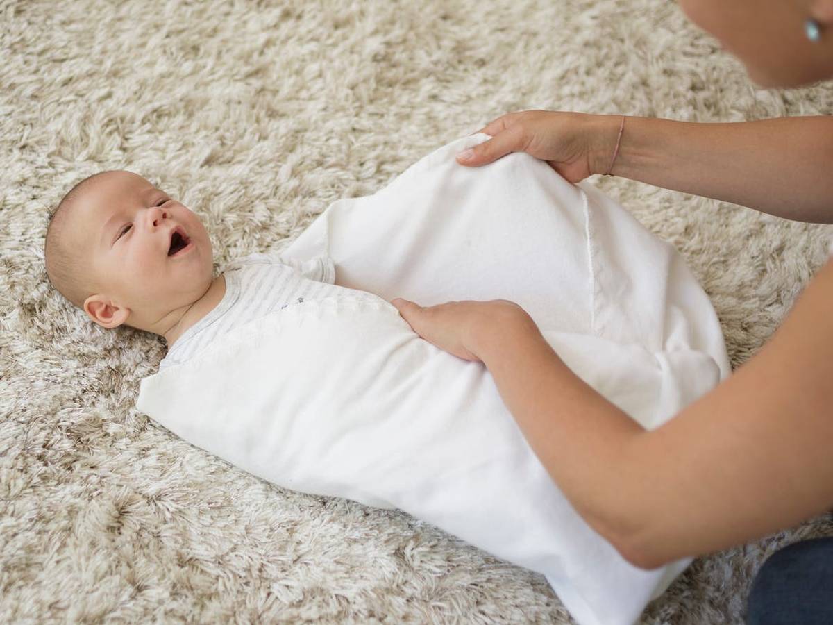 wrapping-a-baby-in-swaddle-blanket