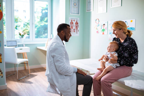 close up of a mother taking her daughter to the pediatrician