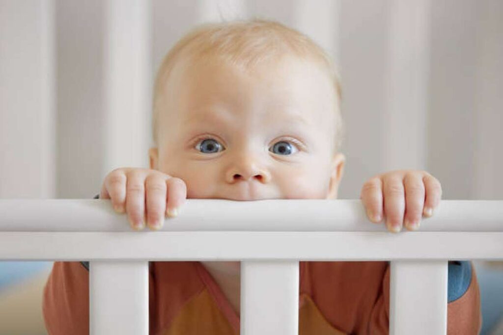 how do i stop my baby from chewing on his crib rails