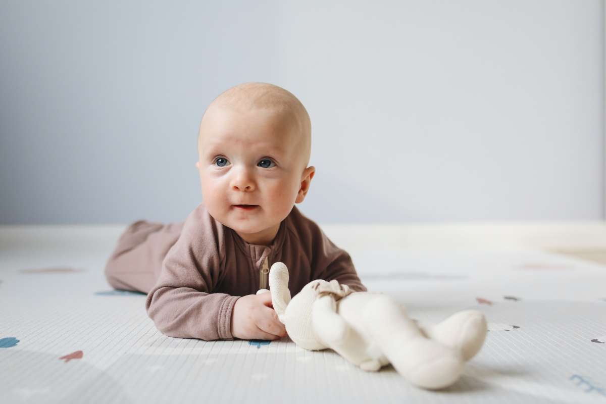 Stopping baby rolling over in outlet cot