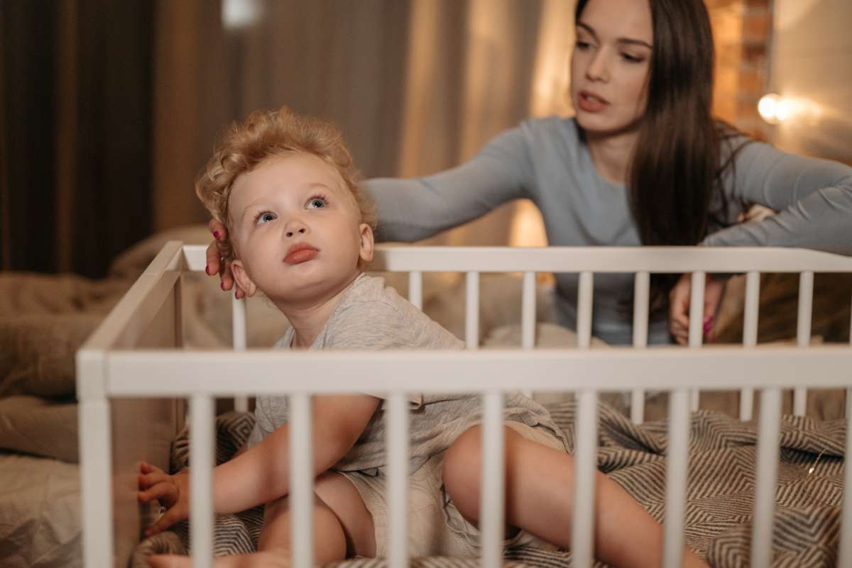 how long can a baby sleep in a bedside crib