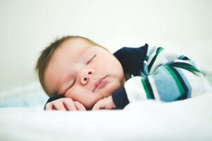 how should a baby with torticollis sleep