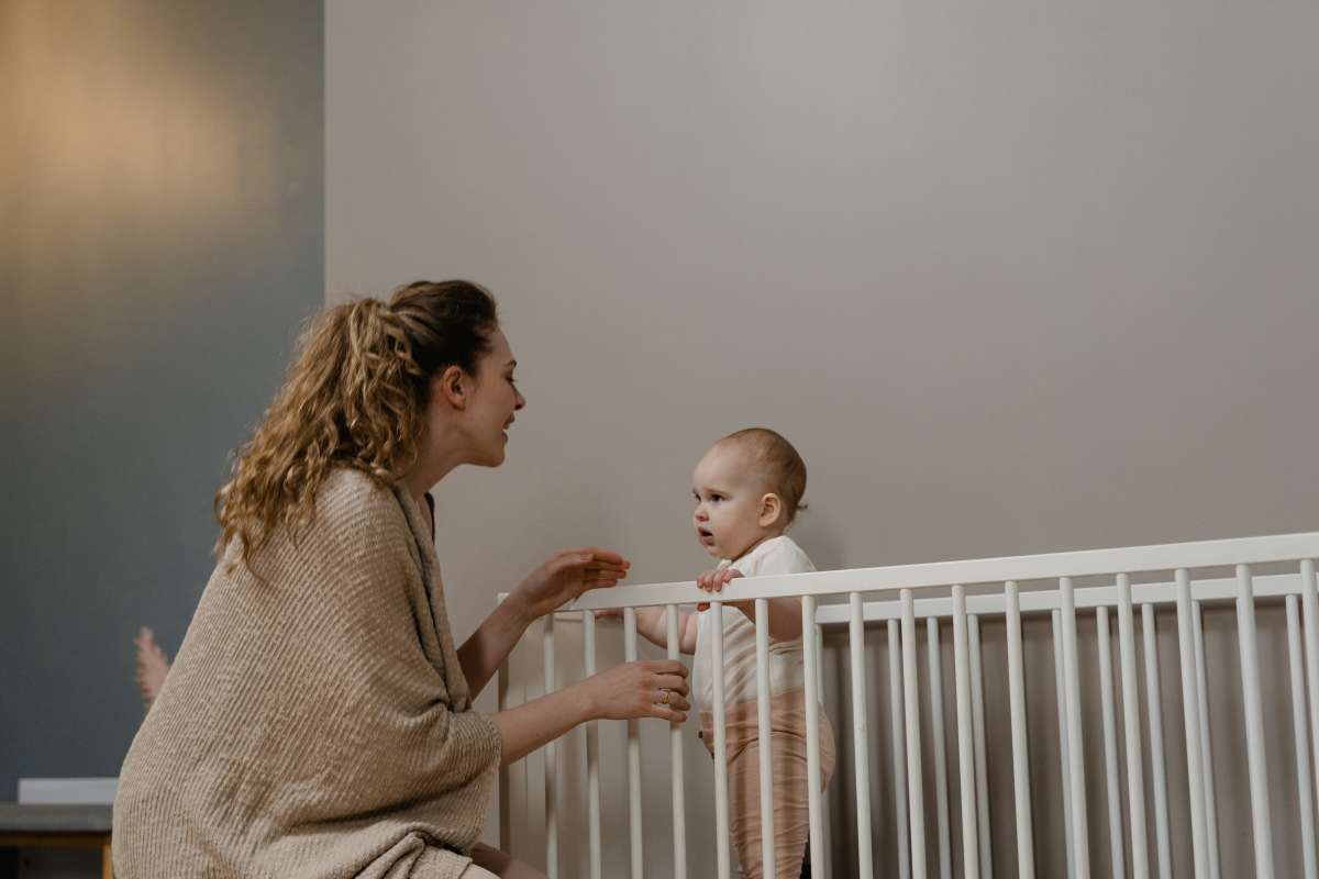 Baby hitting head shop on crib rails